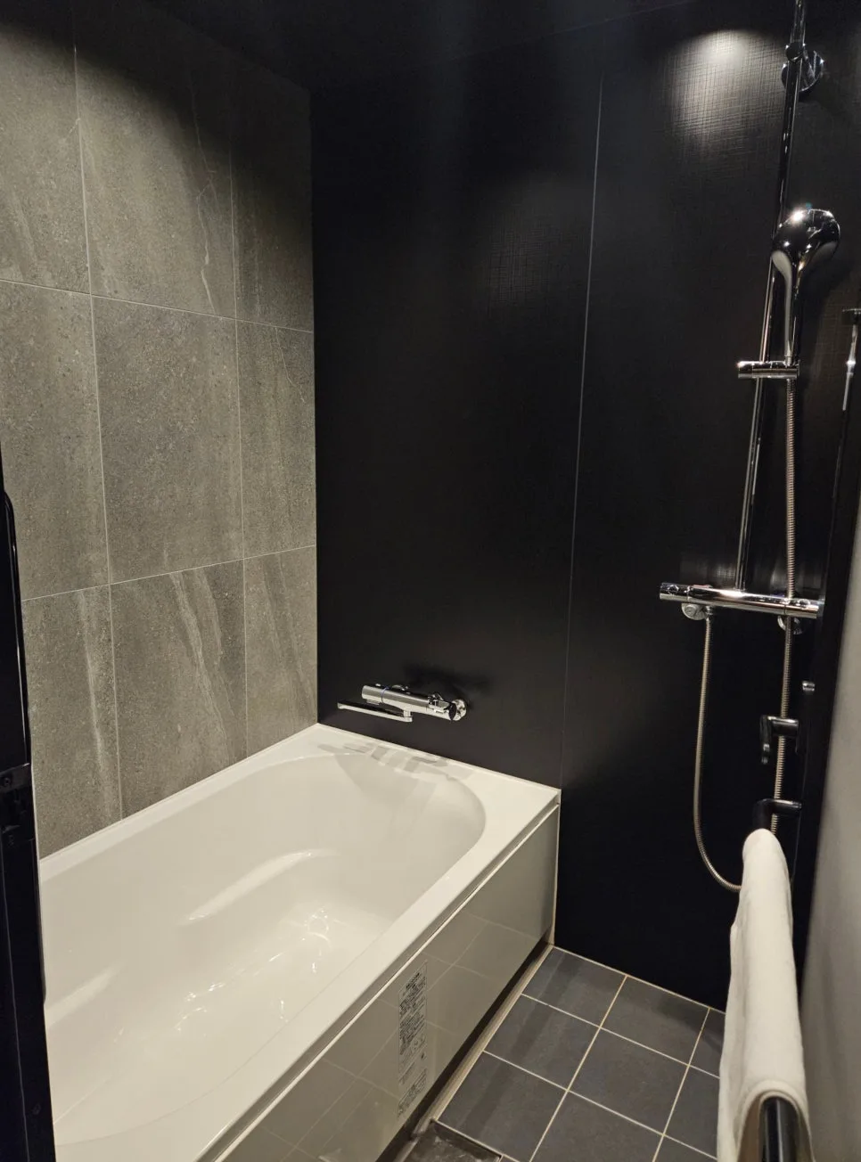bathroom with tub and shower