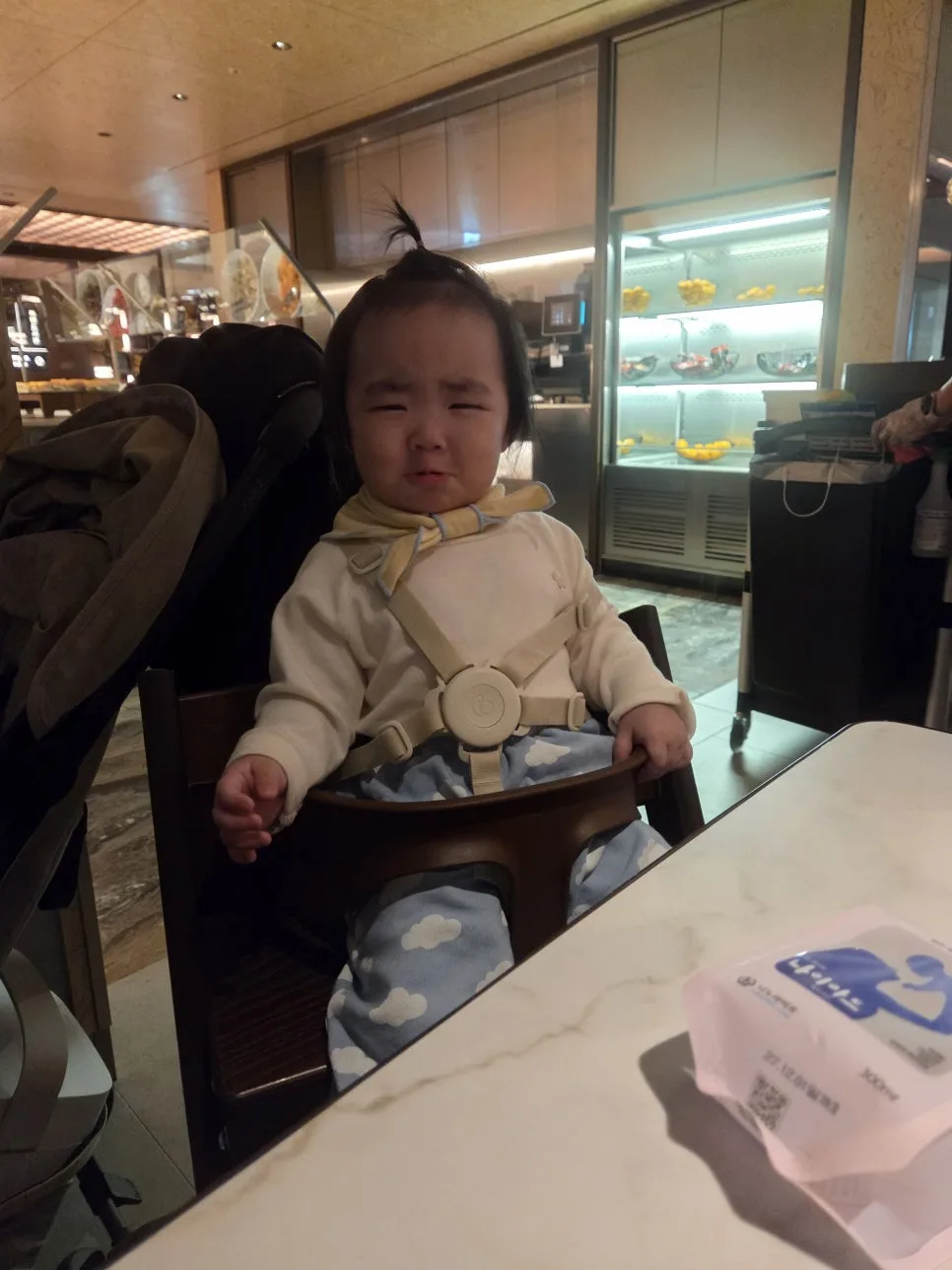baby crying at table