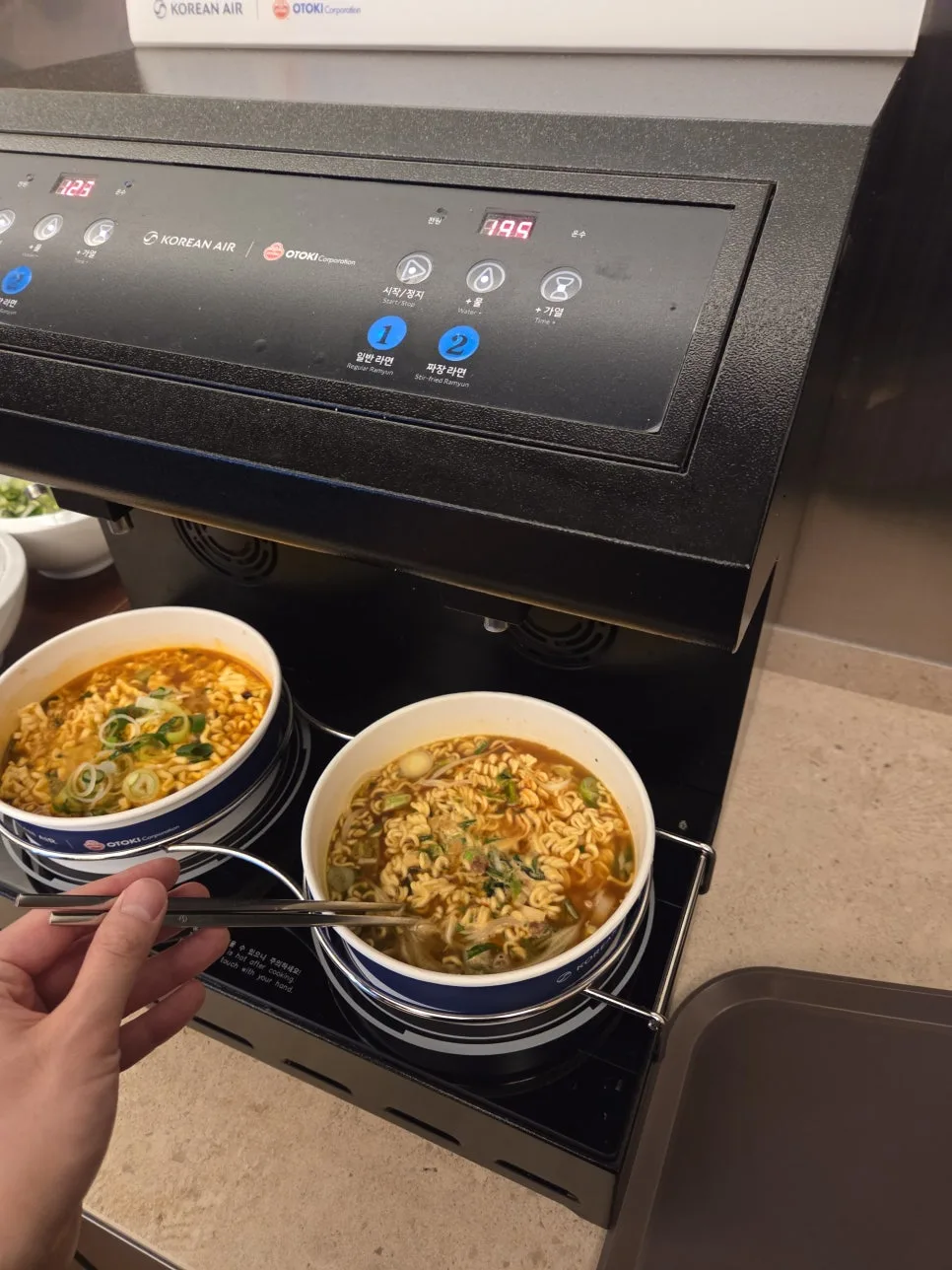 stirring ramen while cooking